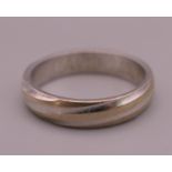 A platinum wedding band, inscribed to inner band DAVID 2.09.06. Ring size I/J. 3.5 grammes.