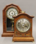 A 19th century rosewood cased mantle clock and an oak mantle clock. The former 44.5 cm high.