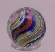 An antique glass marble. 15/16th of an inch diameter.