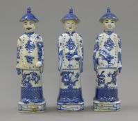 A set of three Chinese blue and white porcelain men. 27 cm high.