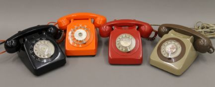 A box of vintage telephones.