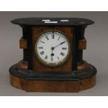 A Victorian walnut mantle clock. 30 cm wide.