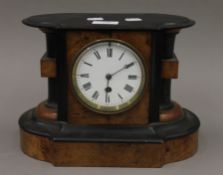 A Victorian walnut mantle clock. 30 cm wide.