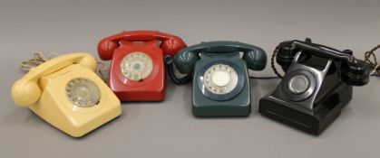 A box of vintage telephones.