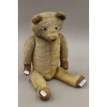 A vintage teddy bear. 57 cm high.