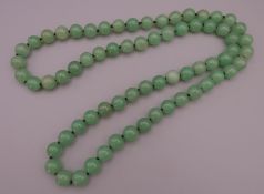 A string of jade beads. Approximately 84 cm long.