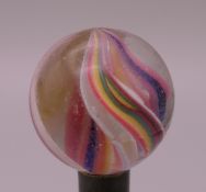 An antique glass marble. 1 inch diameter.