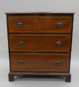 An Edwardian inlaid mahogany chest of drawers. 79.5 cm wide.