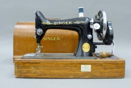 A Singer sewing machine in wooden case.