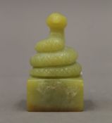 A jade seal in the form of a coiled cobra. 6 cm high.