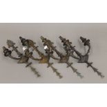 A set of four late 19th/early 20th century bronze twin branch wall lights. 41 cm high.