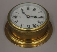 A Sestrel, Henry Browne & Son Ltd, Barking & London brass bulkhead clock. 17.5 cm diameter.