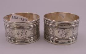 A pair of silver napkin rings. 2.75 cm high, 4 cm diameter. 50.5 grammes.