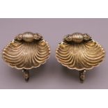 A pair of Victorian silver gilt shell form salts. 7 cm diameter, 4 cm high.