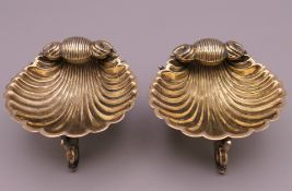 A pair of Victorian silver gilt shell form salts. 7 cm diameter, 4 cm high.