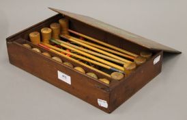 An antique boxed croquet parlour game, up to eight players, circa 1900.