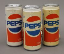 Three novelty Pepsi can telephones.