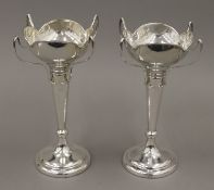 A pair of large silver bud vases. 24 cm high. 693 grammes weighted.