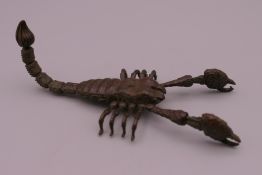 A bronze model of an articulated scorpion. 10 cm long.