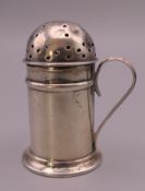 A silver pepper pot. 5.5 cm high. 29 grammes.