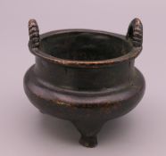 A small bronze censer. 4.5 cm high, 5.5 cm wide.
