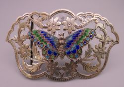 An Art Nouveau silver and enamel belt buckle. 9 cm x 5 cm.