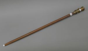 A walking stick mounted with a telescope and compass. 97.5 cm long.