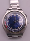 A gentleman's Seiko Bell-Matic Day-Date wristwatch. 4 cm wide.