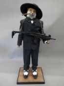 A taxidermy specimen of a Red fox Vulpes vulpes dressed as a gangster. 120 cm high.