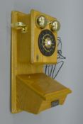 A Classic Collection Edition wall mounted telephone. 42 cm high.