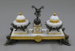A white marble and gilt bronze desk stand. 29 cm wide.