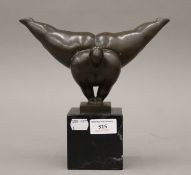 A bronze model of an acrobatic nude. 22 cm high.