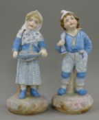 A pair of 19th century Continental bisque figures. The largest 38 cm high.