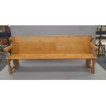 A Victorian pine pew. Approximately 208 cm long.