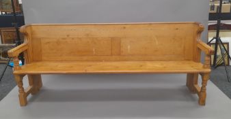 A Victorian pine pew. Approximately 208 cm long.