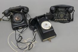 A box of vintage telephones.