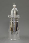 A silver plated cocktail shaker formed as a lighthouse. 35 cm high.