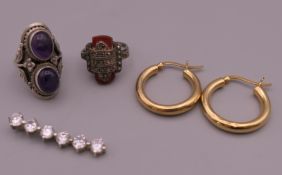 Two rings, a pair of hoop earrings and a pendant. Hoop earrings 2.5 cm diameter.