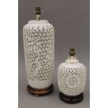 Two Chinese blanc de chine table lamps, standing on wooden bases. The largest 48 cm high overall.