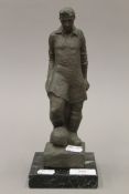 A bronze model of Albert Finney, standing on a loose marble plinth base. 25 cm high.