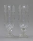 A pair of cut glass storm lamps. 34 cm high.