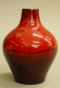 A Royal Doulton flambe vase, signed Noke. 15 cm high.