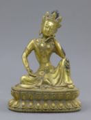 A gilt bronze model of Buddha. 19.5 cm high.