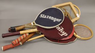 A collection of vintage tennis rackets, etc.