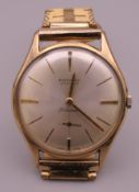 A 9 ct gold gentleman's Rotary Ultra Slim wristwatch, with gilt strap. 3.5 cm wide.