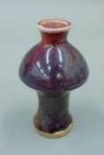 A small Chinese pottery purple splash vase. 12 cm high.