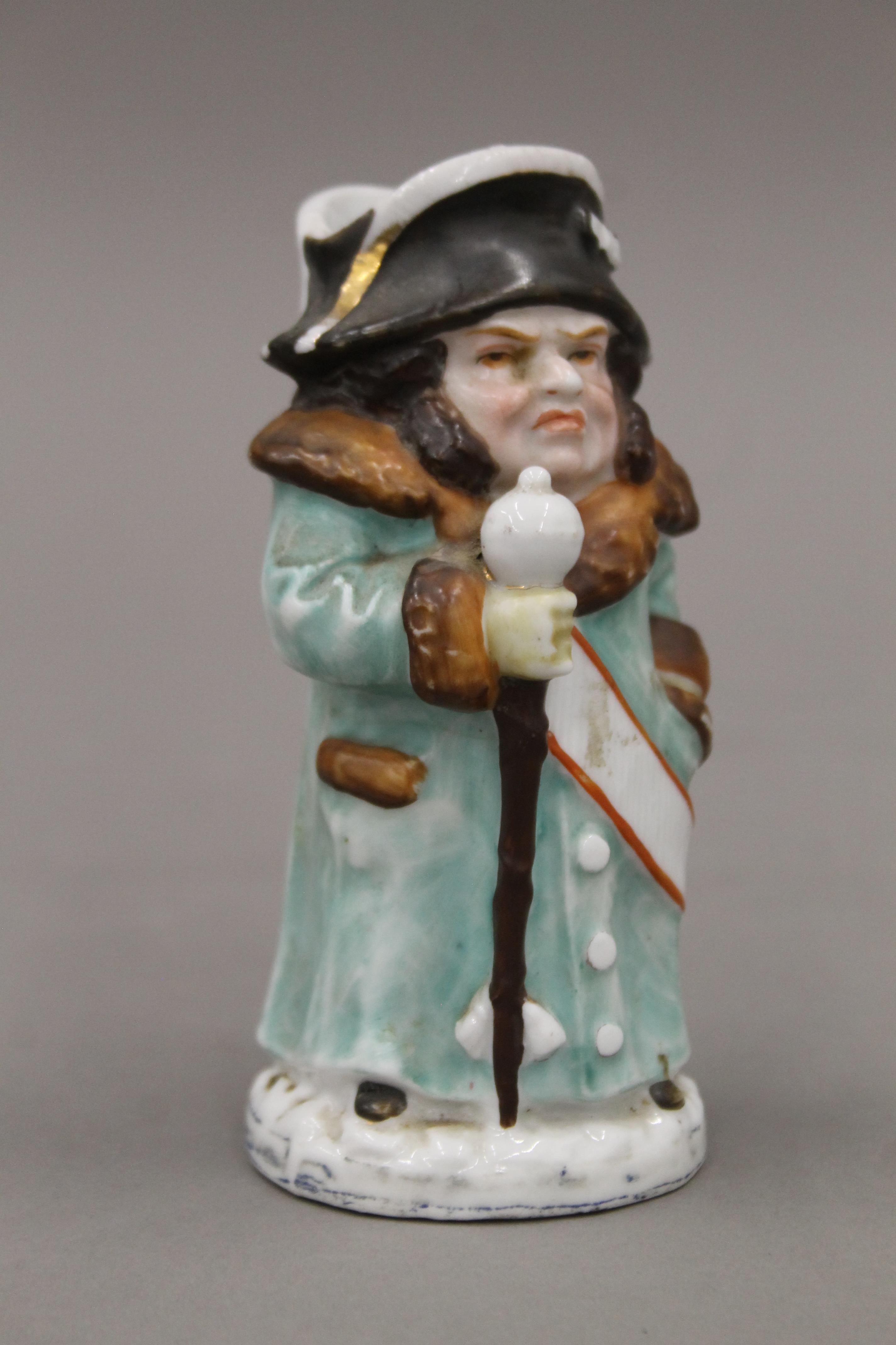 A Victorian porcelain match striker formed as Mr Bumble. 13 cm high. - Image 2 of 3
