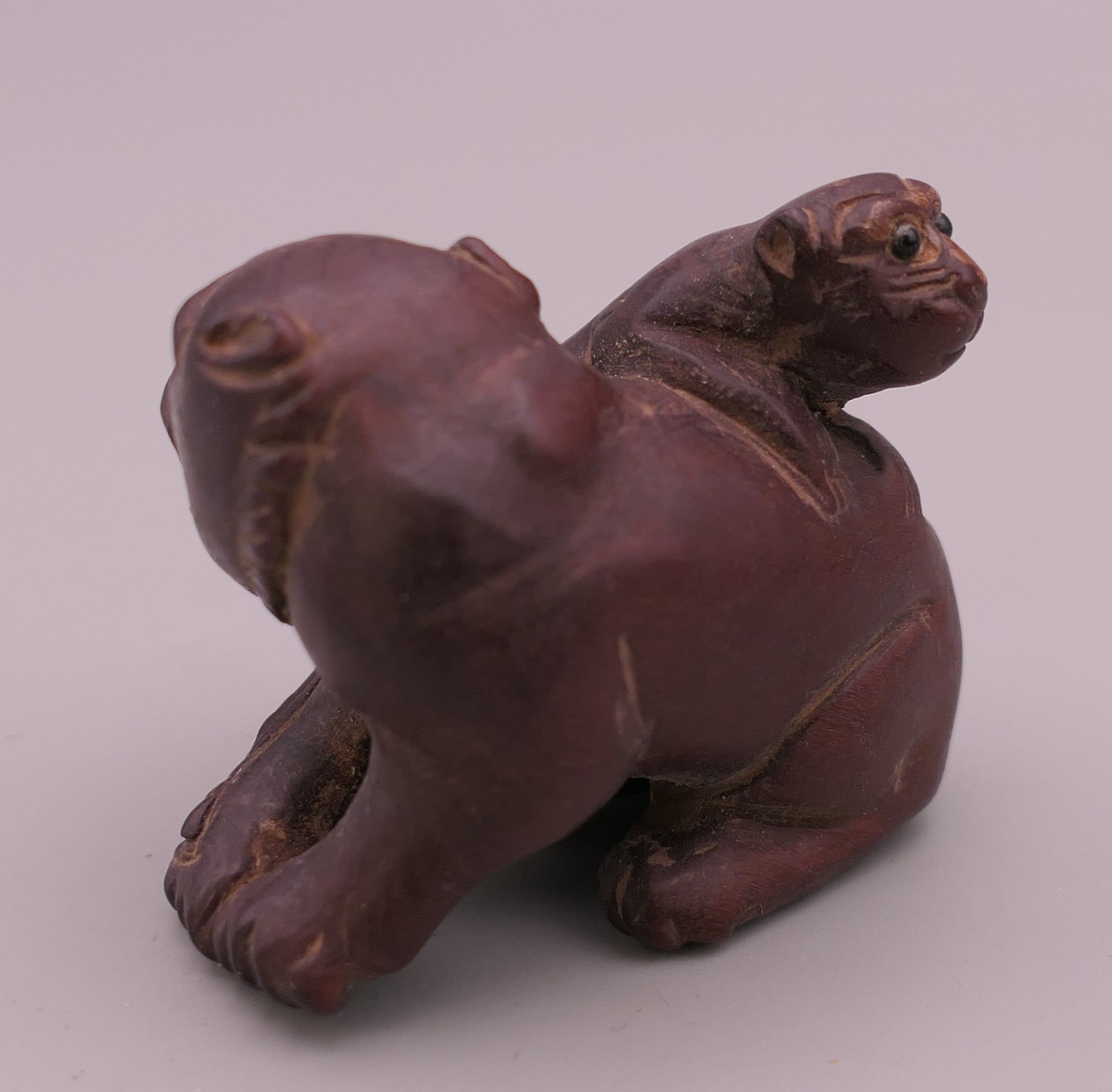 A wooden dog-of-fo form carving. 3.5 cm high. - Image 2 of 2