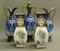 A pair of Victorian vases and a garniture of vases. The largest 41.5 cm high.