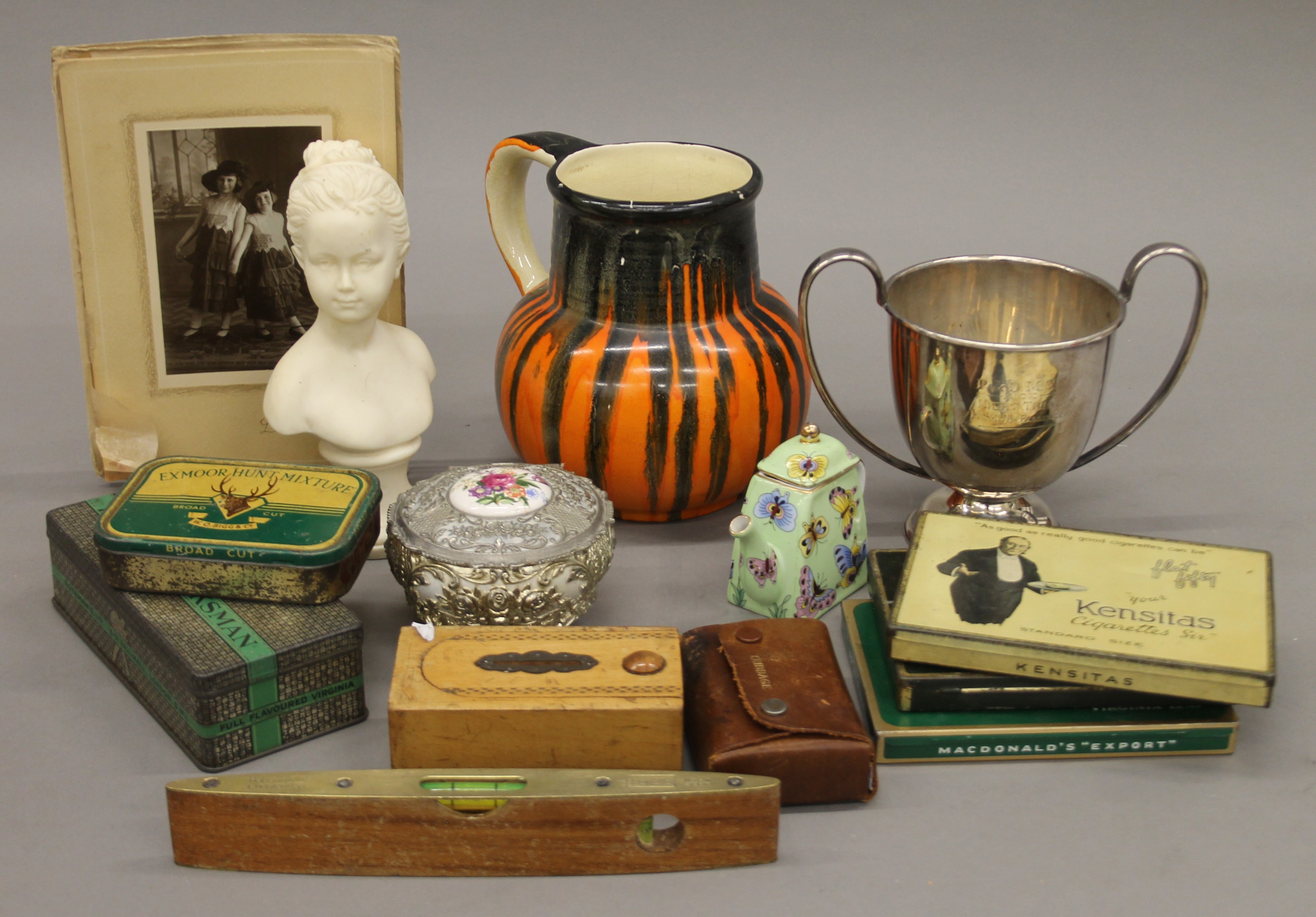A box of miscellaneous items, including ceramics, metalware, etc.